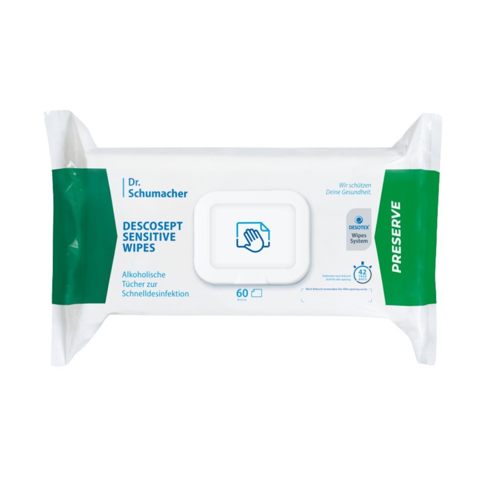 O cutie de șervețele dezinfectante Dr. Schumacher Descosept Sensitive Wipes, produse de Dr. Schumacher GmbH, pentru dezinfectarea rapidă. Eticheta precizează că este vorba de șervețele pe bază de alcool, ideale pentru suprafețe de dimensiuni medii. Cutia este în mare parte albă, cu accente verzi, și conține 60 de șervețele.