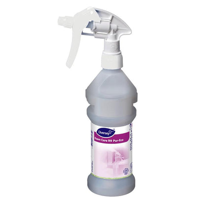 Sticla de pulverizare Room Care R9 Plus Pur-Eco, goală de la Diversey Deutschland GmbH & Co. OHG, este prevăzută cu un declanșator alb și o etichetă alb-violet cu pictograme de curățenie - ideală pentru curățarea ecologică.