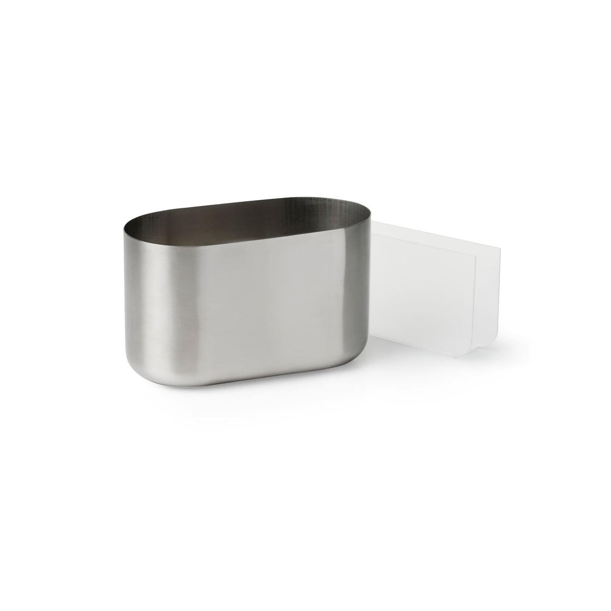Suportul de tacâmuri și șervețele Duni GmbH oval Pond, un suport de masă oval din oțel inoxidabil cu partea superioară deschisă și un accesoriu lateral dreptunghiular alb, este ilustrat pe un fundal simplu alb.