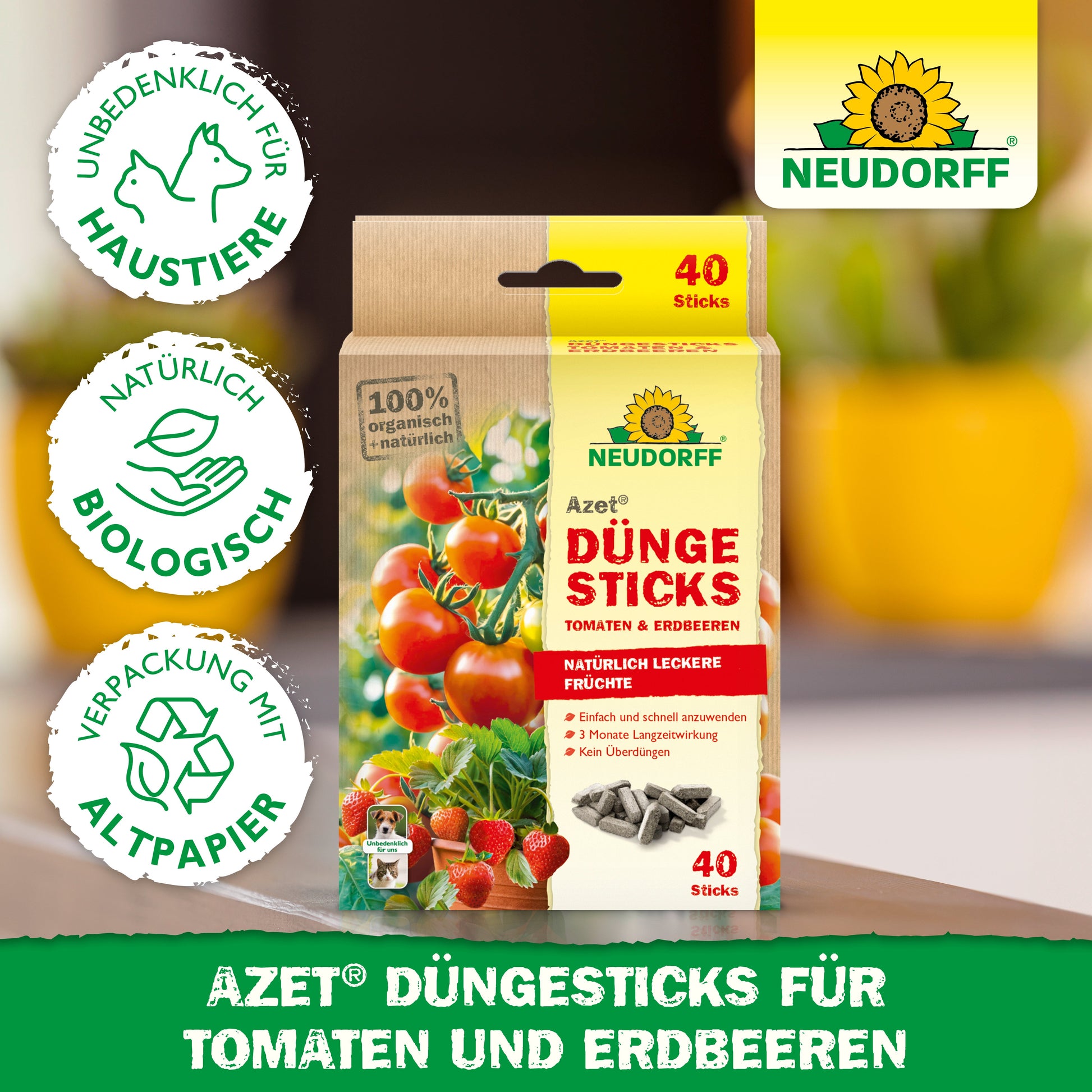 Eine Packung Neudorff Shop Azet Düngesticks für Tomaten & Erdbeeren steht aufrecht auf einem Tisch, mit deutschem Text, Produkteigenschaften und umweltfreundlichen Symbolen.