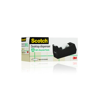 O cutie cu dispenserul de bandă adezivă de birou Scotch™ C38, negru, de la 3M Deutschland GmbH. Ambalajul evidențiază dispenserul, subliniază că nu conține bandă adezivă și este ideal ca accesoriu de birou.