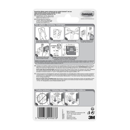 Auf der Rückseite einer Packung der 3M Deutschland GmbH Kleine Command™ Strips S, 17022N befinden sich bebilderte, mehrsprachige Hinweise zum Anbringen und Entfernen von Klebestreifen ohne Nägel, um Wände beschädigungsfrei zu halten, sowie ein Barcode am unteren Rand.