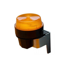 Un indicator luminos Swingo 2500/3500 de la Diversey Deutschland GmbH & Co. OHG, cu un capac chihlimbar canelat, montat pe un suport negru-argintiu, este ilustrat pe un fundal alb.