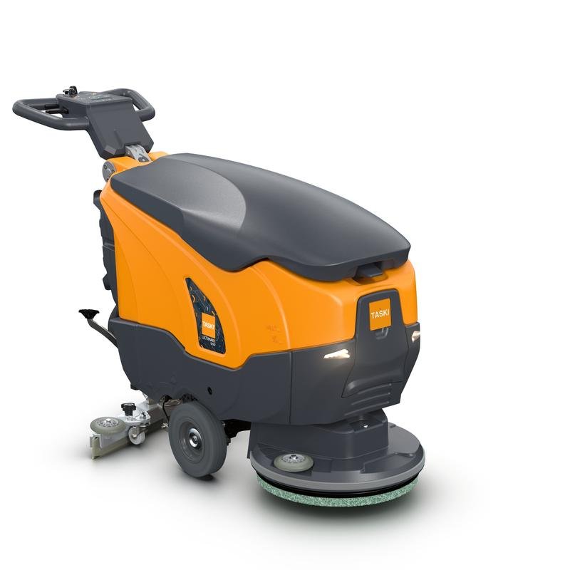 TASKI ULTIMAXX 900 SD43 de la Diversey Deutschland GmbH & Co. OHG este o mașină de spălat fără tracțiune de nouă generație, cu un rezervor de 20 de litri și un disc unic de 43 cm, care se remarcă printr-un design portocaliu-gri, un mâner, un panou de control și roți pentru mobilitate.