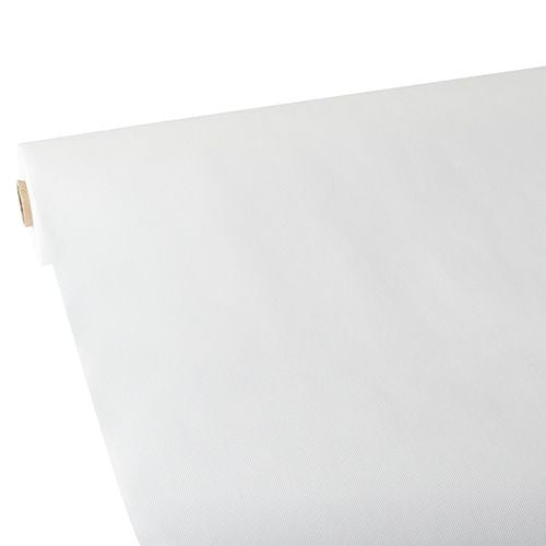 Un sul mare de față de masă Starpak, asemănătoare cu materialul textil, fleece „Soft Selection“ (25 m x 1,18 m, alb) este desfășurat pe o suprafață plană, cu suprafața netedă vizibilă la marginea îndoită în sus. Rola Starpak este văzută în diagonală dintr-un colț.