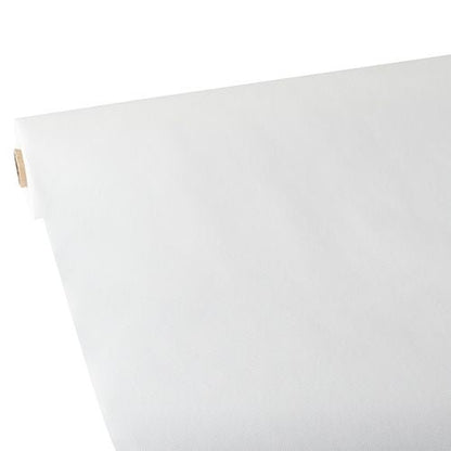 Un sul mare de față de masă Starpak, asemănătoare cu materialul textil, fleece „Soft Selection“ (25 m x 1,18 m, alb) este desfășurat pe o suprafață plană, cu suprafața netedă vizibilă la marginea îndoită în sus. Rola Starpak este văzută în diagonală dintr-un colț.