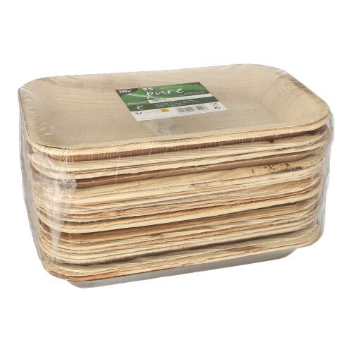 Un teanc de PAPSTAR 25 tăvi, frunză de palmier „pure” dreptunghiulară de la PAPSTAR GmbH, ambalat în folie transparentă cu etichetă verde-albă; aceste plăci dreptunghiulare sunt biodegradabile.