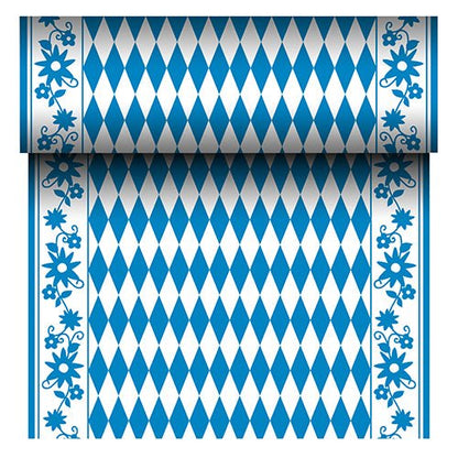 Fuga de masă Airlaid "Bayrisch Blau" (24 m x 40 cm) de la PAPSTAR GmbH este o fugă de masă asemănătoare cu materialul textil, cu un centru de romburi albastre și albe și o bordură de flori albastre. Rola afișează modelul bavarez repetitiv la derulare.