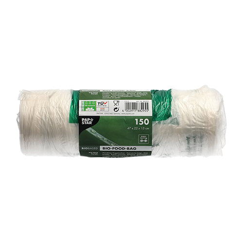 O rolă cu 150 de PAPSTAR pungi cu nod (47x22 cm) din folie bio transparentă de la PAPSTAR GmbH prezintă o banderolă verde-albă cu informații și simboluri despre produs, care este ilustrată nefolosită pe un fundal alb.
