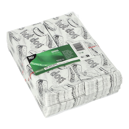 Cele 1000 de pungi PAPSTAR pentru hot dog (21x8,5 cm, albe) de la PAPSTAR GmbH sunt sigilate și prevăzute cu o grafică neagră de hot dog și inscripția "Hot Dog". O etichetă verde cu informații despre produs este atașată.