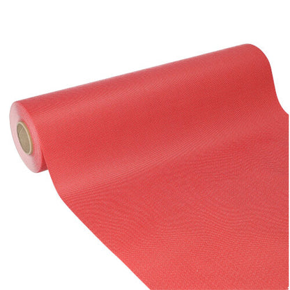Fuga de masă Starpak, asemănător țesăturii, material netesut „soft selection plus“ (24 m x 40 cm) este parțial derulată, cu miezul de carton vizibil. Suprafața sa ușor texturată roșie este ideală ca fugă de masă pentru ocazii speciale.