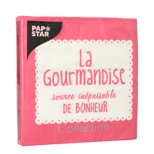 Eine rosafarbene Packung PAPSTAR 20 Servietten, 33x33 cm, 3-lagig, mit weißem, gewelltem Etikett mit der Aufschrift "La Gourmandise, source inépuisable de bonheur." Oben links steht "PAP STAR", unten steht "Collection".