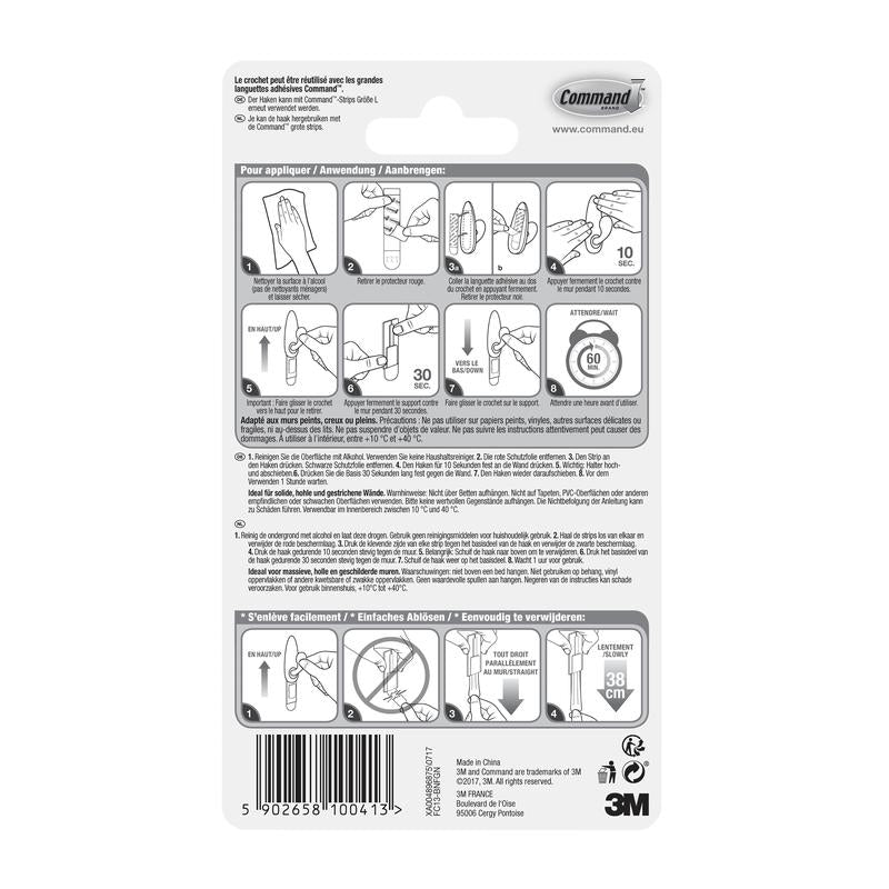 Partea din spate a ambalajului cârligelor metalice Command™ „clasic” (3M Deutschland GmbH) cu instrucțiuni ilustrate pas cu pas în mai multe limbi pentru utilizare și îndepărtare corectă, precum și avertismente și informații despre produs în partea de jos.