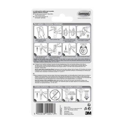 Partea din spate a ambalajului cârligelor metalice Command™ „clasic” (3M Deutschland GmbH) cu instrucțiuni ilustrate pas cu pas în mai multe limbi pentru utilizare și îndepărtare corectă, precum și avertismente și informații despre produs în partea de jos.