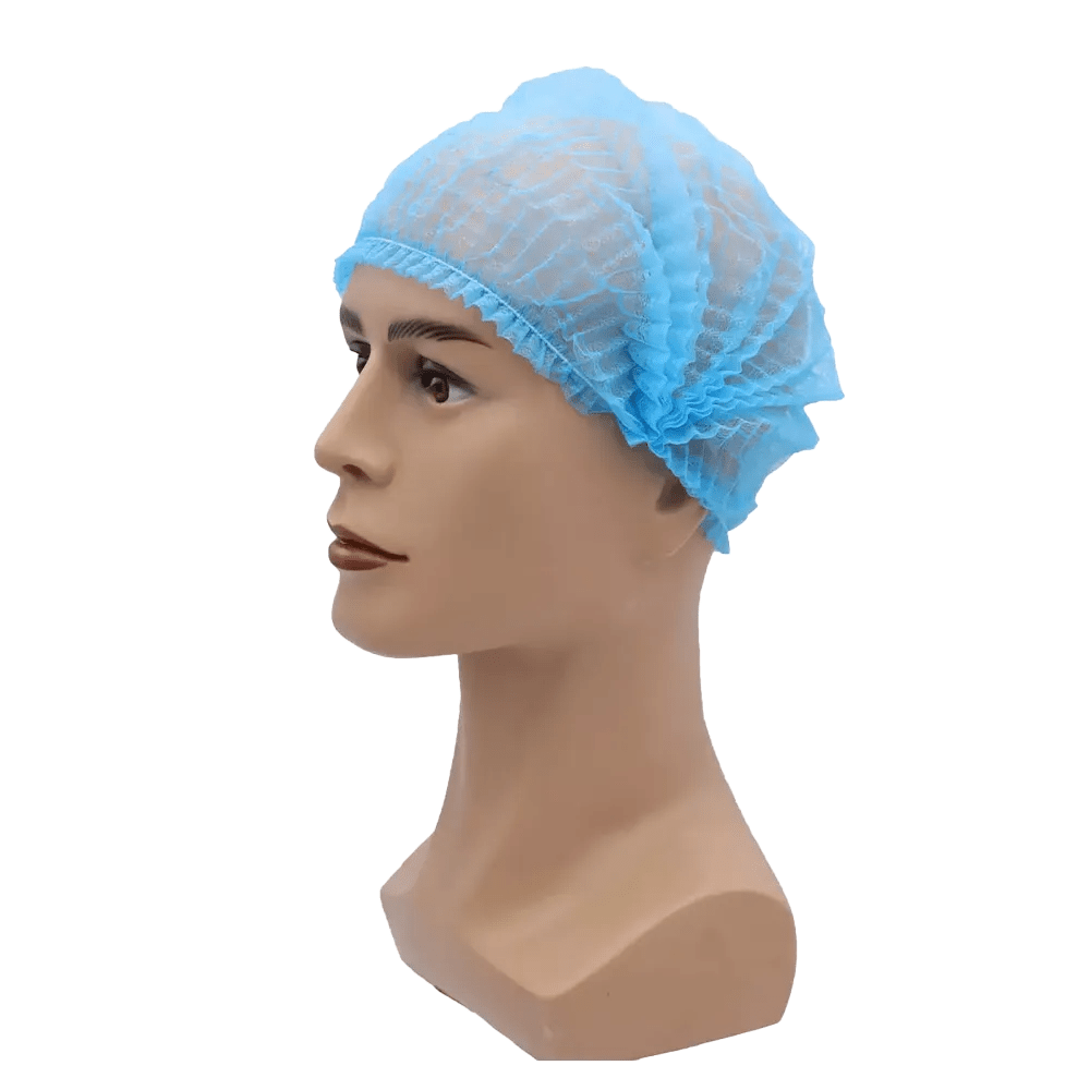 Un cap de păpușă poartă o plasă de păr albastră AMPri MED-COMFORT Klipphaube 52 cm, de la AMPri Handelsgesellschaft mbH. Plasa de păr din polipropilenă ușoară, cu margini elastice, se mulează strâns pe capul păpușii și oferă protecție igienică. Imaginea este vizibilă pe un fundal simplu alb.