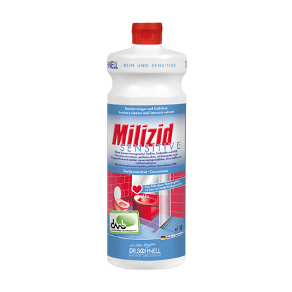 O sticlă Dr. Schnell Milizid Sensitive Detergent sanitar și dizolvant de calcar cu capac roșu este special concepută pentru suprafețe rezistente la acizi. Funcția sa de detergent și dizolvant de calcar pentru zone sensibile este evidențiată prin imagini ale unei toalete și ale unui duș pe etichetă. Numele mărcii „DR.SCHNELL GmbH & Co. KGaA” este plasat proeminent la bază.
