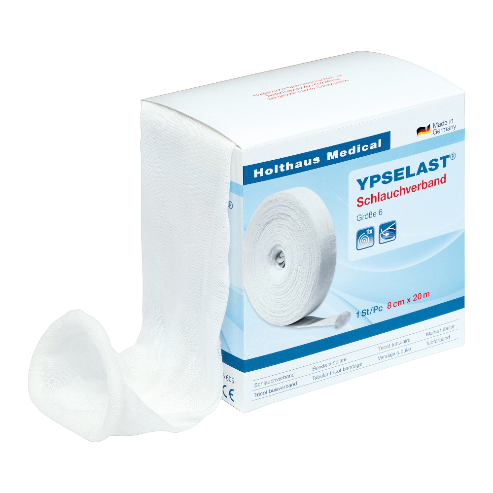 O cutie albă Holthaus Ypselast® bandaj tubular în diferite dimensiuni de la Holthaus Medical GmbH & Co. KG. Cutia conține text albastru și roșu, precum și o imagine a bandajului parțial derulat. Bandajul are o lățime de 8 cm și o lungime de 20 m, iar pe ambalaj scrie că este fabricat în Germania.