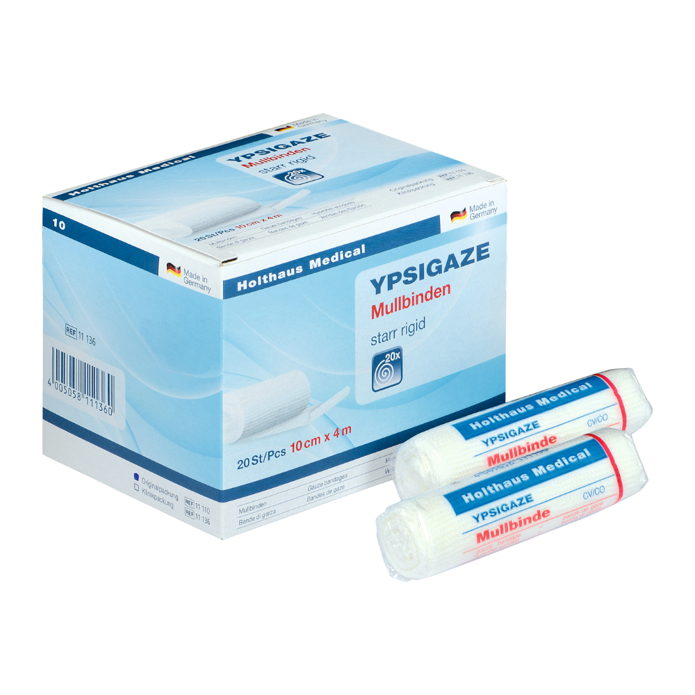 Pe lângă două role individuale, este expusă o cutie cu bandaj de tifon Holthaus Ypsigaze de la Holthaus Medical GmbH & Co. KG. Bandajul rigid are dimensiunea de 10 cm x 4 m și conține 20 de bucăți.
