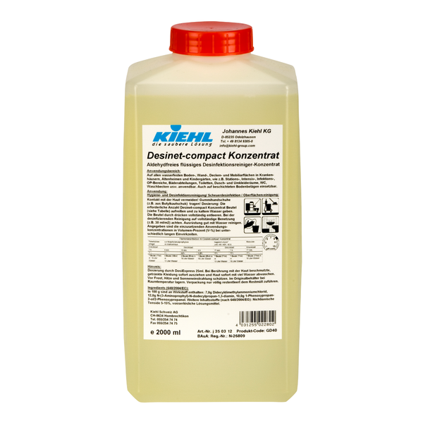 Un recipient de plastic dreptunghiular de 2 litri cu capac roșu și etichetă albă afișează marca Johannes Kiehl KG și informațiile despre produs pentru Kiehl Desinet-compact Concentrat, un concentrat lichid de curățare dezinfectant fără aldehidă în limba germană.