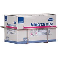 Un suport Novocal din oțel inoxidabil pentru cutii de măști (pentru fixarea pe șina Euro, 1 bucată/pachet) susține o cutie dreptunghiulară cu inscripția „Foliodress mask”, care conține măști de protecție de unică folosință. Marcă: Novocal.