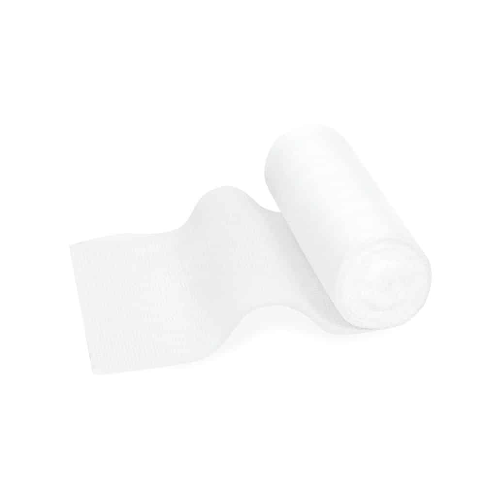 O rolă de bandaj elastic de fixare Meditrade ABE® Last – diferite dimensiuni, parțial derulată, așezată pe un fundal alb simplu. Hârtia este moale și are o textură de bandaj elastic de fixare.