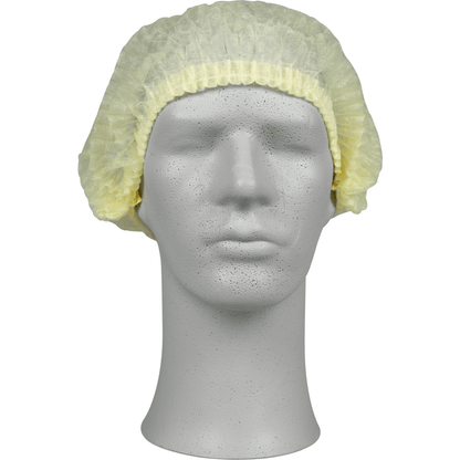 Pe un cap de manechin gri se află o bonetă galben deschis, PP de la Abena Re-Seller GmbH, care oferă protecție igienică pentru domeniul medical sau gastronomic. Boneta de unică folosință acoperă partea superioară și lateralele capului.
