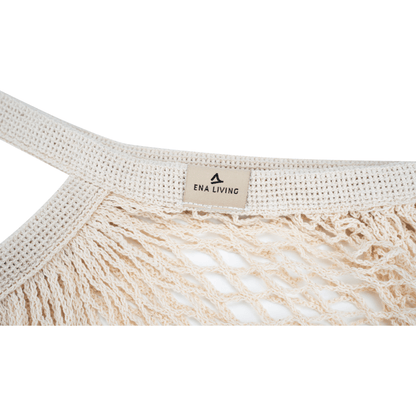 Prim-plan al unei rețele de cumpărături ENA Living crem de la Abena Re-Seller GmbH cu mâner împletit, robust și etichetă "ENA LIVING" - perfectă pentru cumpărături ecologice; disponibilă ca cutie (24 de pachete).