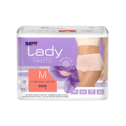 Eine Verpackung der saugfähigen Unterwäsche Seni Lady Pants in Größe Medium, die für Inkontinenz entwickelt wurde, zeigt ein Bild des Produkts an einem weiblichen Model. Die Verpackung hebt Eigenschaften wie Atmungsaktivität und Sicherheit hervor. Das Produkt ist von der TZMO Deutschland GmbH.
