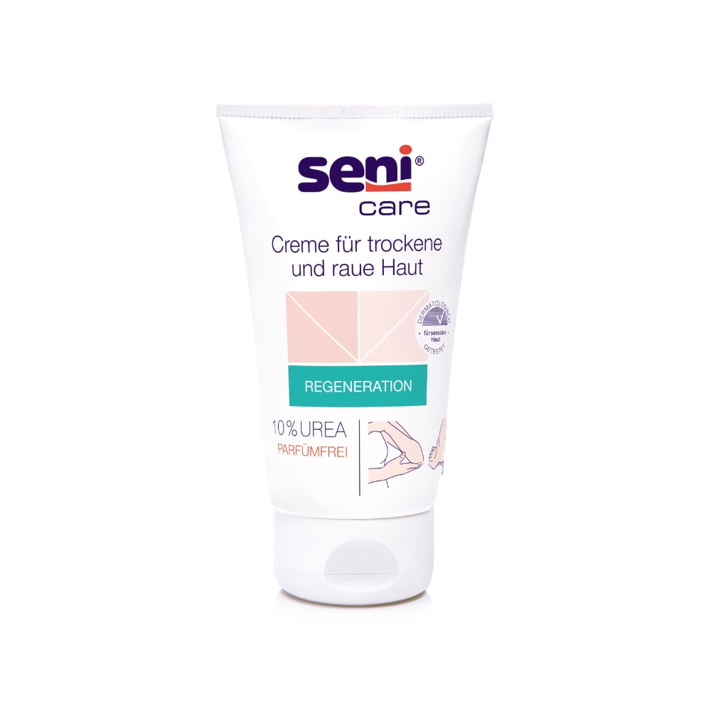 Un tub de 100 ml de cremă Seni Care de la TZMO Deutschland GmbH pentru piele uscată și aspră are un fundal alb cu accente roz deschis și verzi. Eticheta indică 10% uree, este fără parfum, crește conținutul de umiditate și conține instrucțiuni în germană.