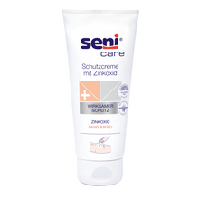 Un tub alb de la TZMO Deutschland GmbH cu inscripția „Seni Schutzcreme mit Zinkoxid“ impresionează prin proprietăți precum efectul de protecție eficient, conținutul de oxid de zinc și o formulă fără parfum, ceea ce o face ideală pentru îngrijirea pielii.