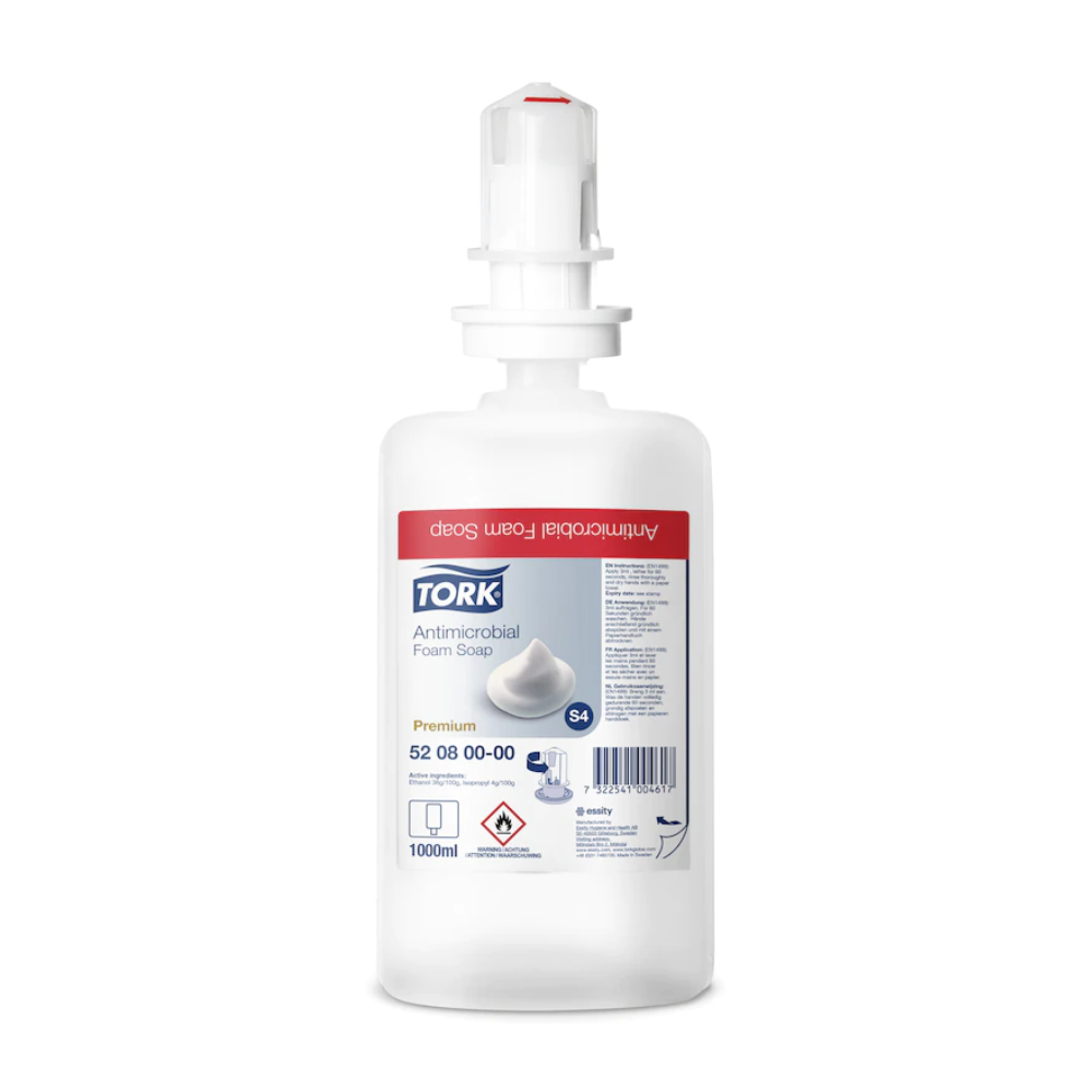Un săpun spumant Tork 520800 de 1000 ml pentru decontaminarea mâinilor, sticlă Premium S4 de la TORK - Essity Professional Hygiene Germany GmbH, cu cap de dozator alb și etichetă roșie. Certificat EN 1499, ideal pentru decontaminarea eficientă a mâinilor.