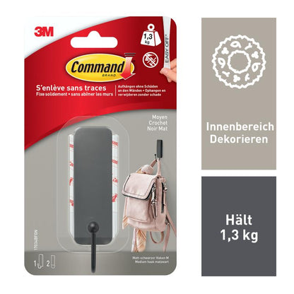 Un pachet de la 3M Deutschland GmbH cu 1 cârlig Command™ mat negru de dimensiuni medii (17034B) și 2 benzi; suportă până la 1,3 kg, nu necesită găurire. Include cârlig de perete negru, benzi adezive și o imagine exemplu; informații în franceză și germană.